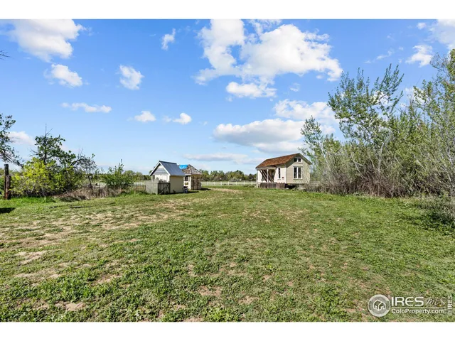 a aerial view of a house with a yard