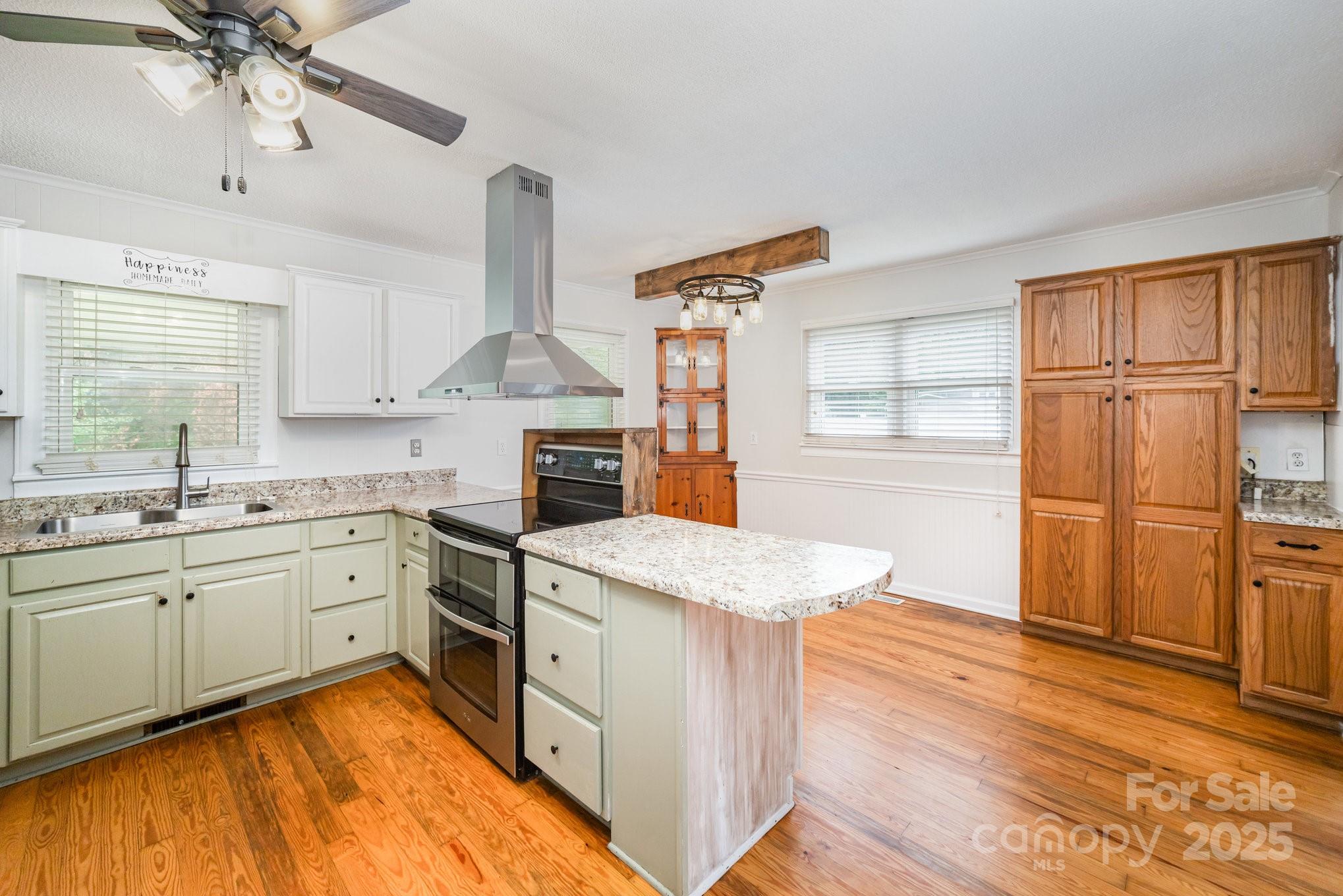264 Mauney Farm Road Cherryville, NC 28021 - Photo 11 of 25 a kitchen with stainless steel appliances granite countertop a sink stove and refrigerator