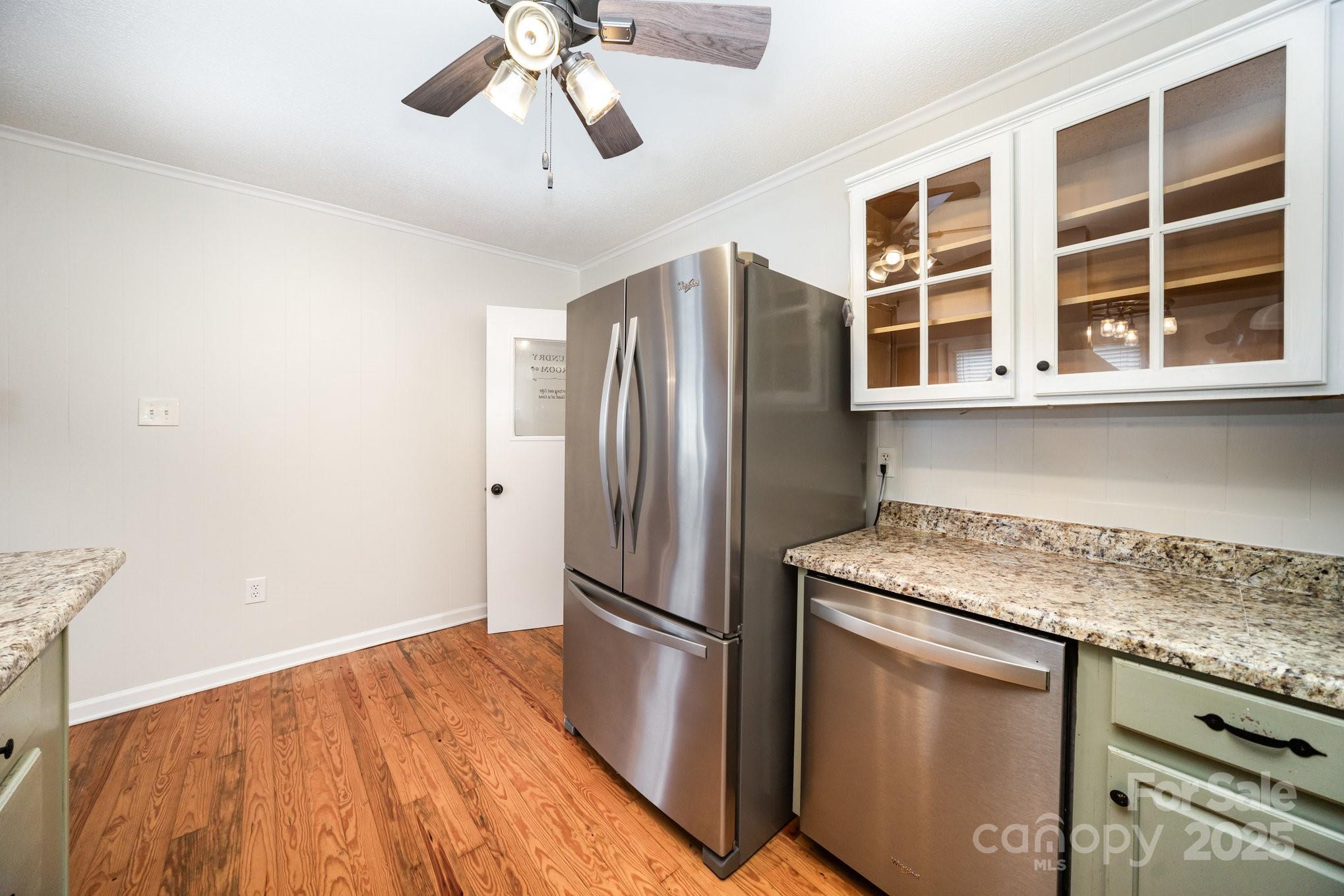 264 Mauney Farm Road Cherryville, NC 28021 - Photo 12 of 25 a kitchen with stainless steel appliances granite countertop a refrigerator and a sink