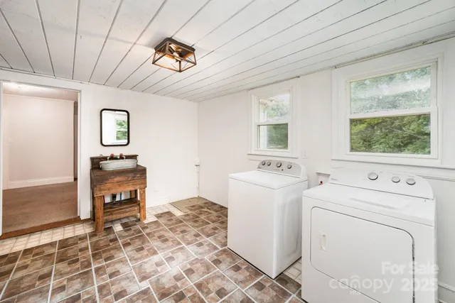 a view of a hallway with washer and dryer