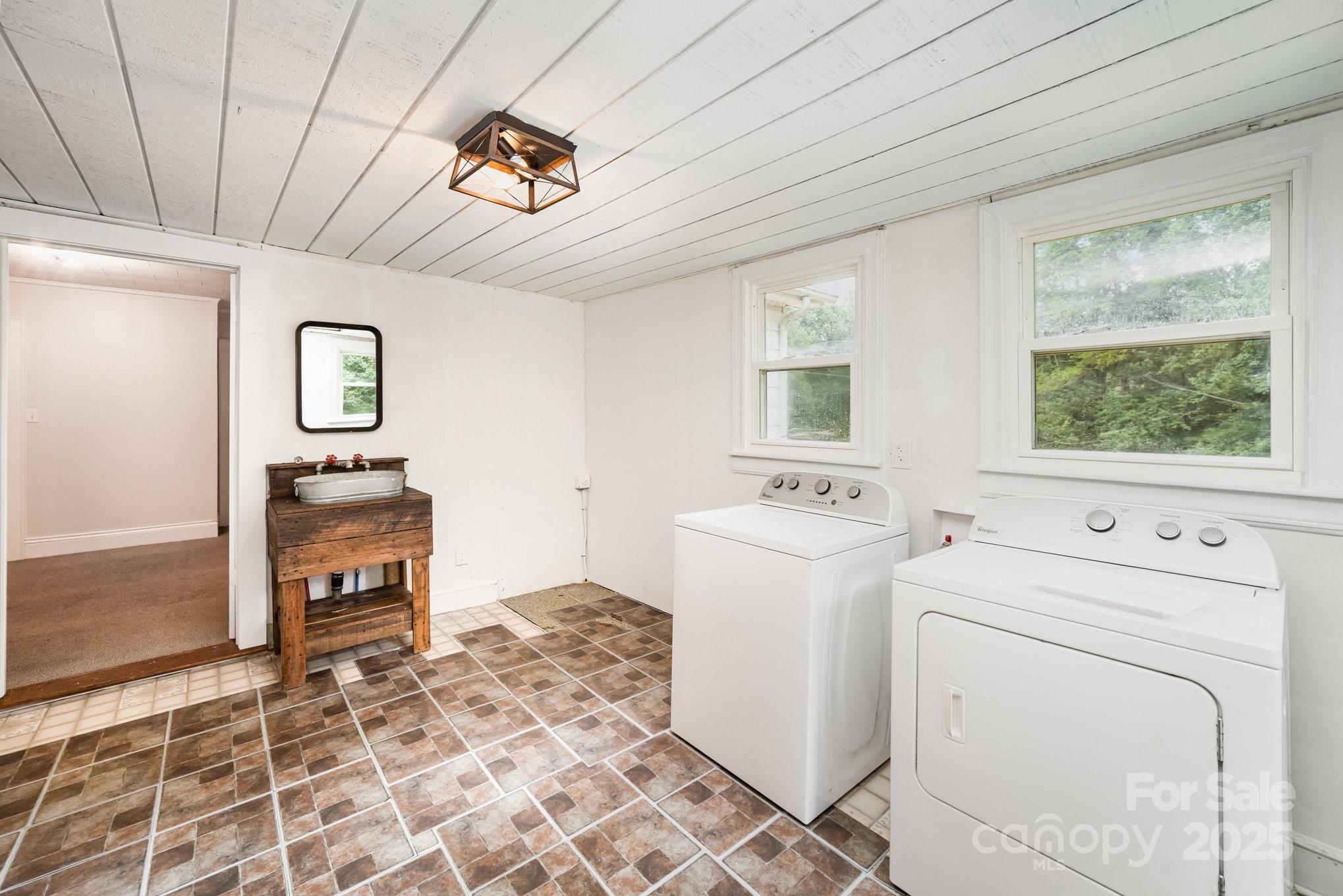 264 Mauney Farm Road Cherryville, NC 28021 - Photo 14 of 25 a view of a hallway with washer and dryer
