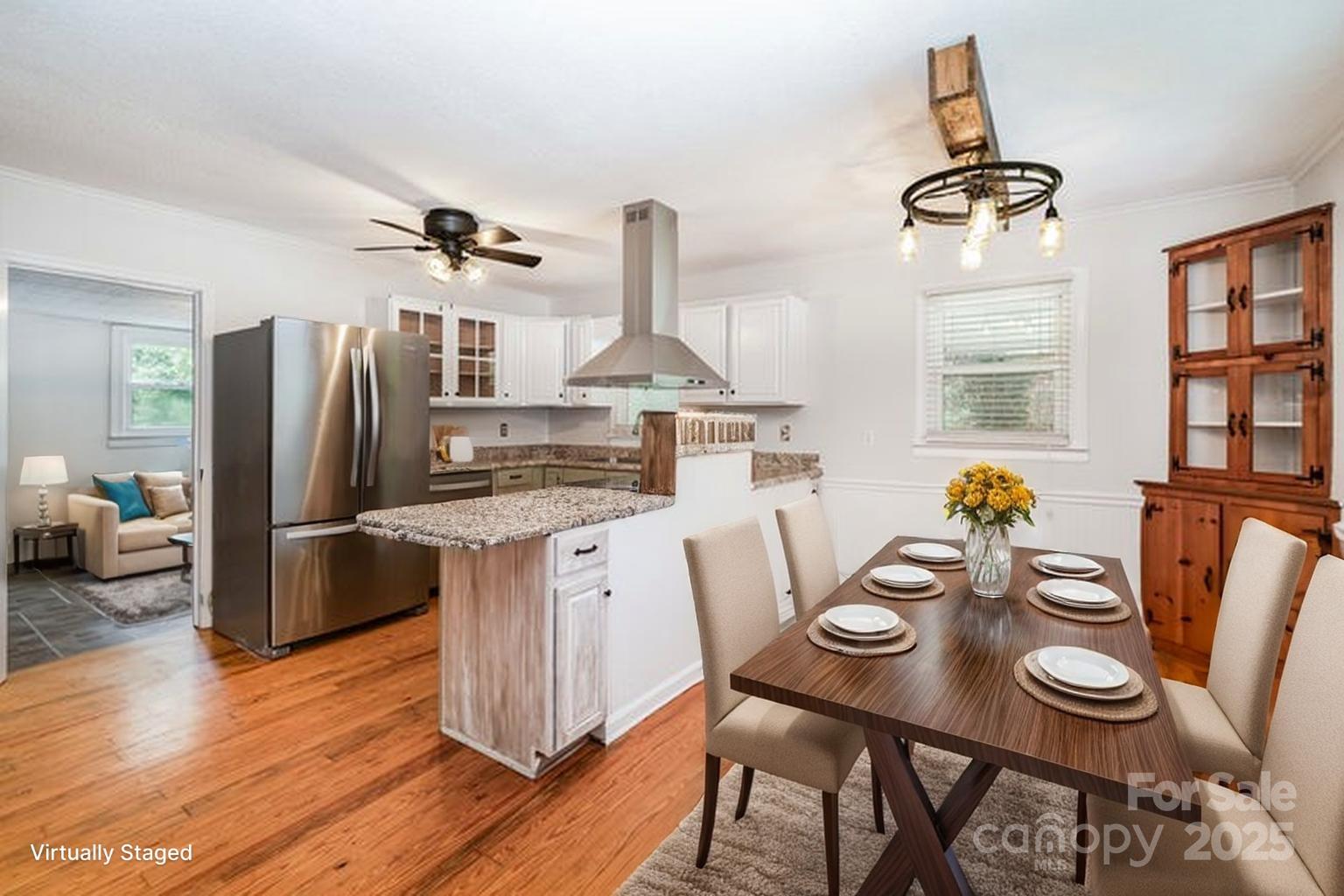 264 Mauney Farm Road Cherryville, NC 28021 - Photo 9 of 25 a kitchen with stainless steel appliances a dining table and chairs