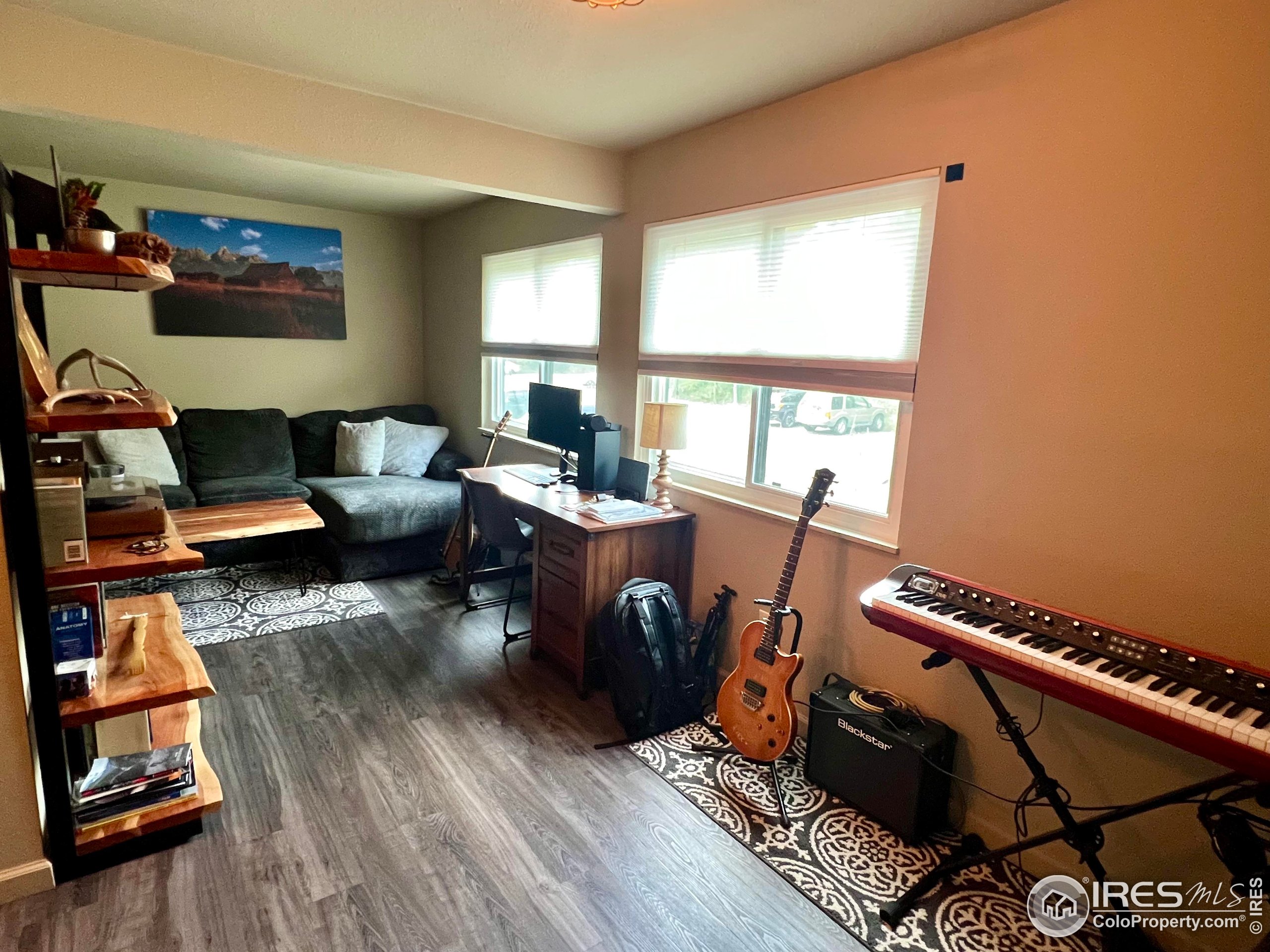1705 Heatheridge Road, Unit M204 Fort Collins, CO 80526 - Photo 11 of 35 a living room with furniture a rug and a window