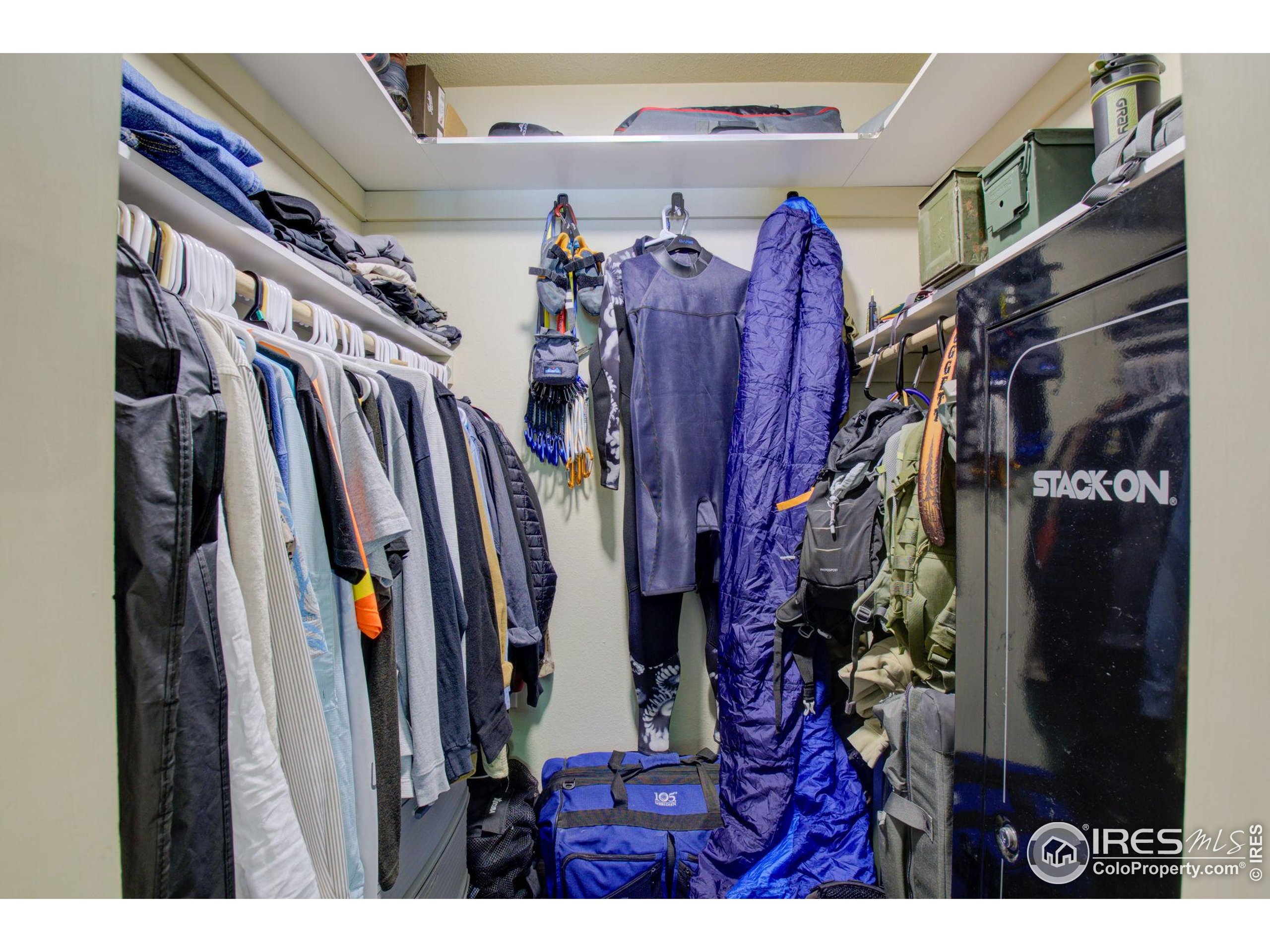 1705 Heatheridge Road, Unit M204 Fort Collins, CO 80526 - Photo 14 of 35 a view of walk in closet with clothes