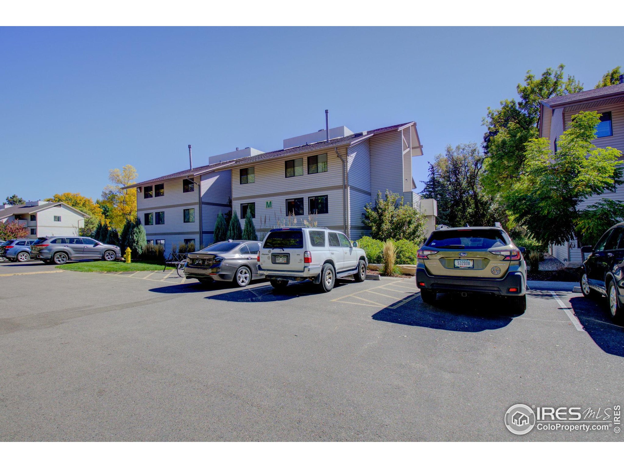 1705 Heatheridge Road, Unit M204 Fort Collins, CO 80526 - Photo 19 of 35 a car parked in front of a house