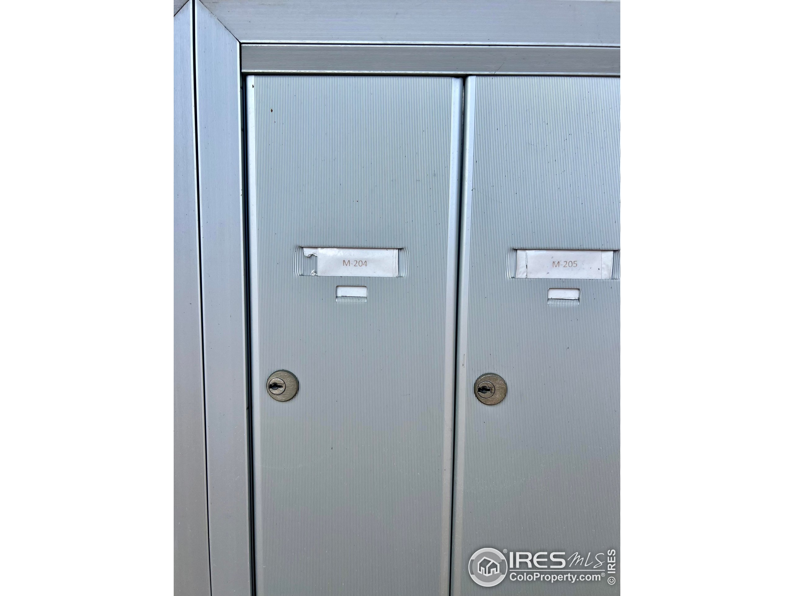 1705 Heatheridge Road, Unit M204 Fort Collins, CO 80526 - Photo 33 of 35 a bathroom with a glass shower door