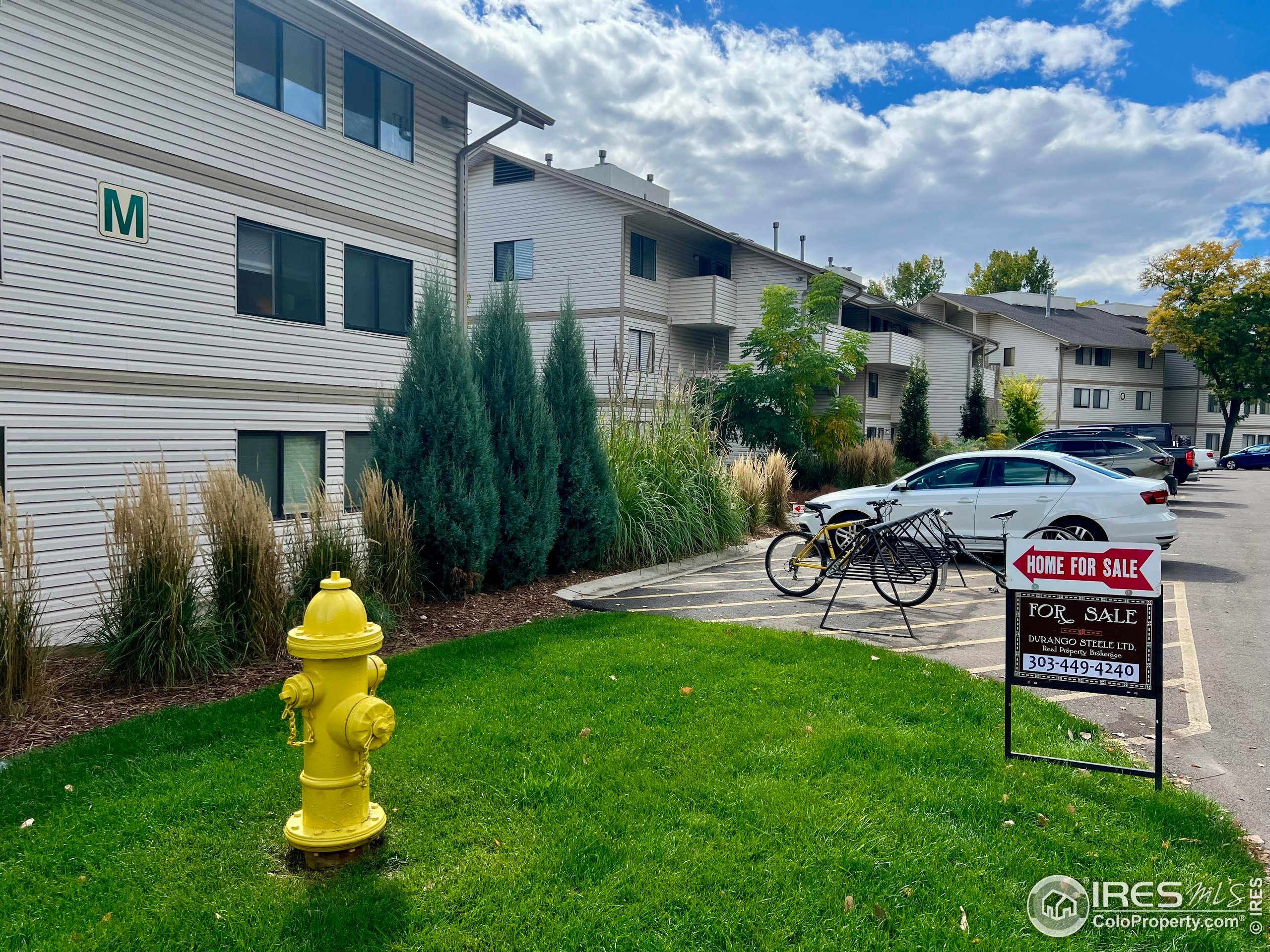 1705 Heatheridge Road, Unit M204 Fort Collins, CO 80526 - Photo 35 of 35 a front view of house with yard and outdoor seating