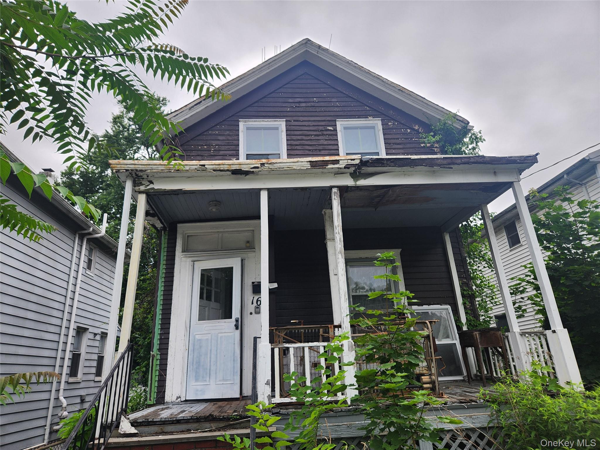 View of front of house with covered porch