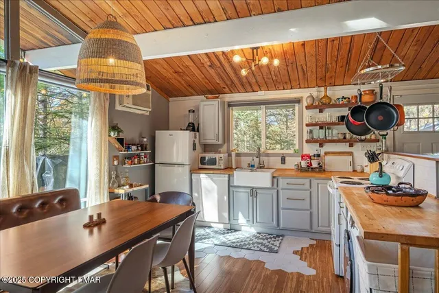 a kitchen with a table chairs and a stove