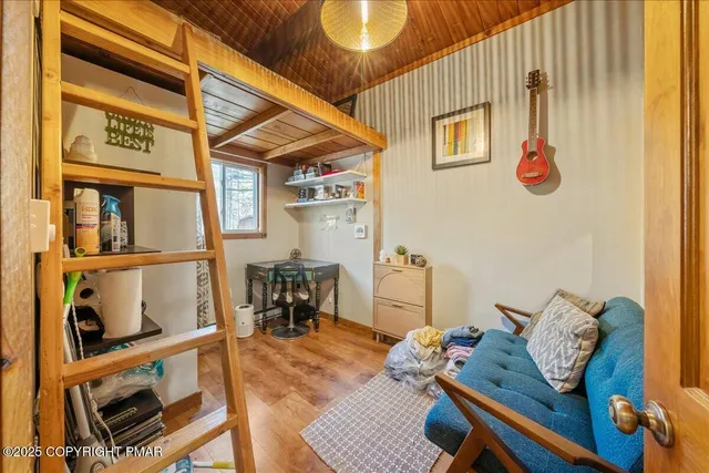 a room with furniture and wooden floor