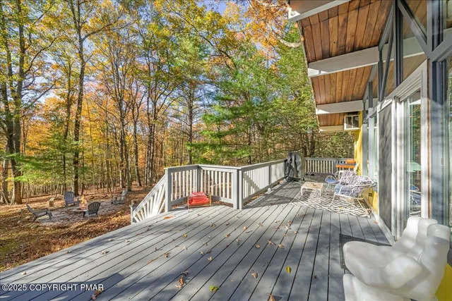 a view of balcony with wooden floor and outdoor space