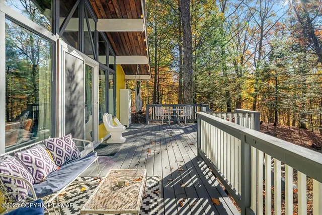 a view of balcony with wooden floor