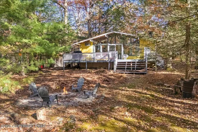 a view of house with yard