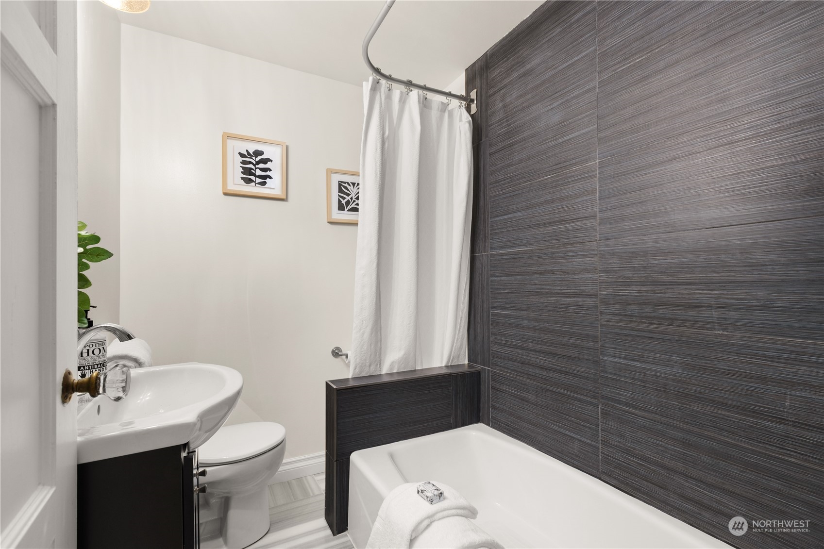 4115 Southwest 106th Street Seattle, WA 98146 - Photo 14 of 40 a bathroom with a sink and toilet