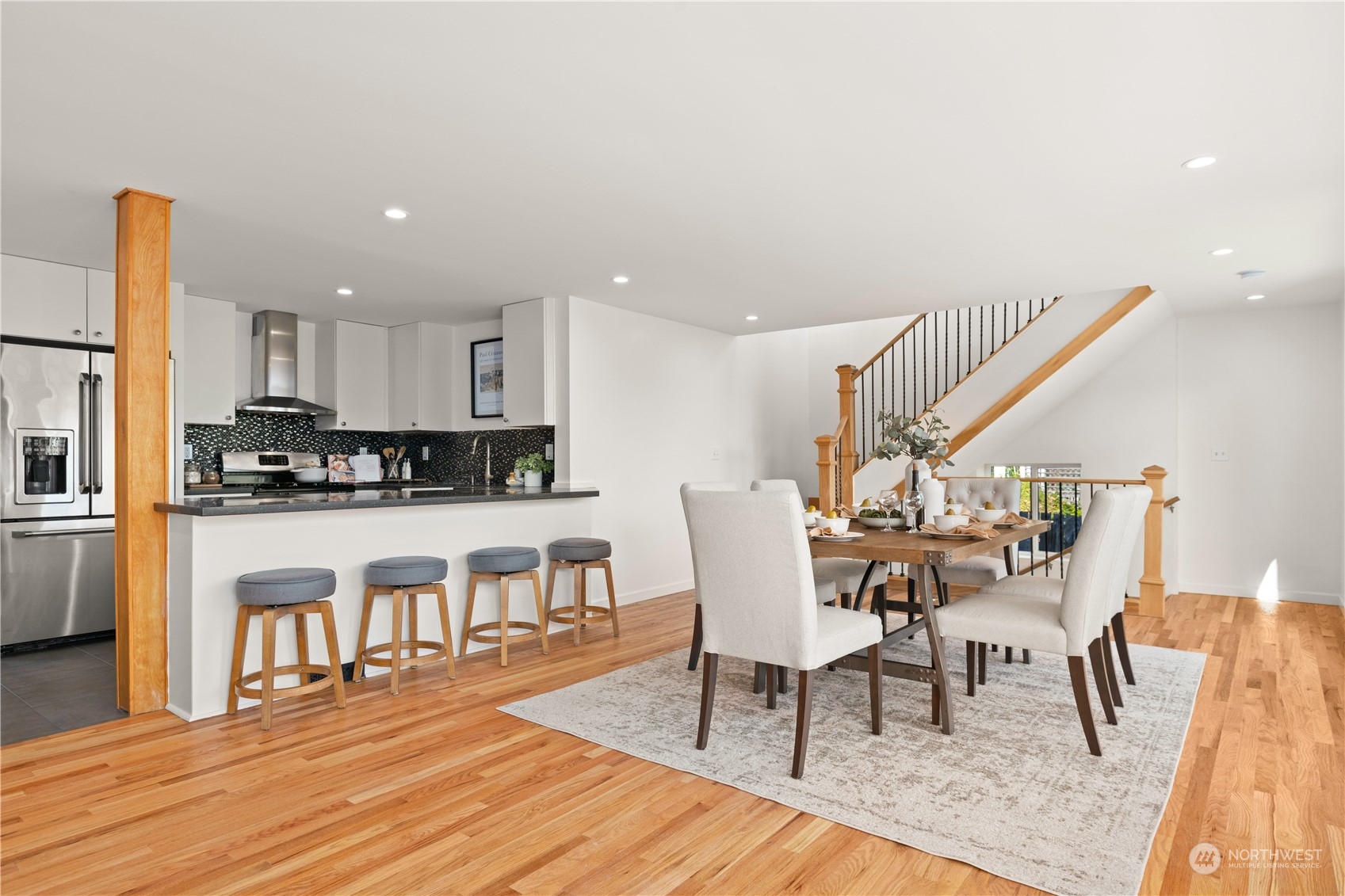 4115 Southwest 106th Street Seattle, WA 98146 - Photo 7 of 40 a view of a dining room with furniture and wooden floor