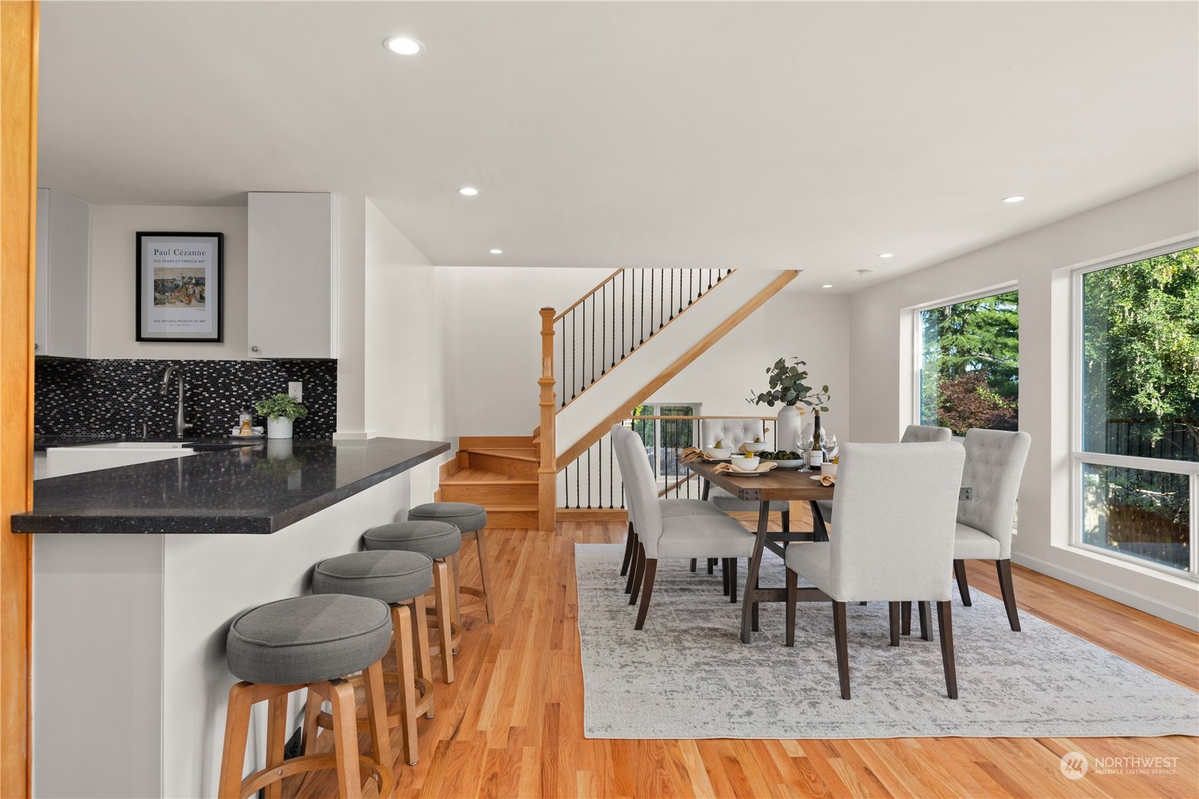 4115 Southwest 106th Street Seattle, WA 98146 - Photo 10 of 40 a living room with furniture and a dining table with wooden floor