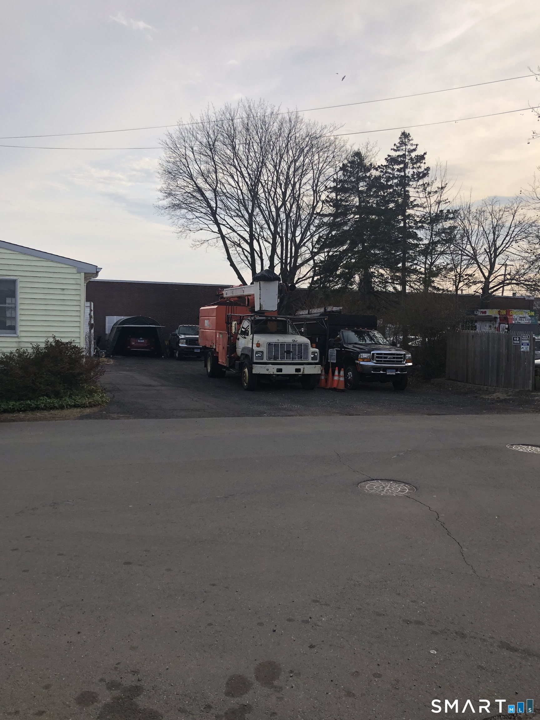 15 Oregon Avenue Hamden, CT 06514 - Photo 4 of 16 Side lot with trucks
