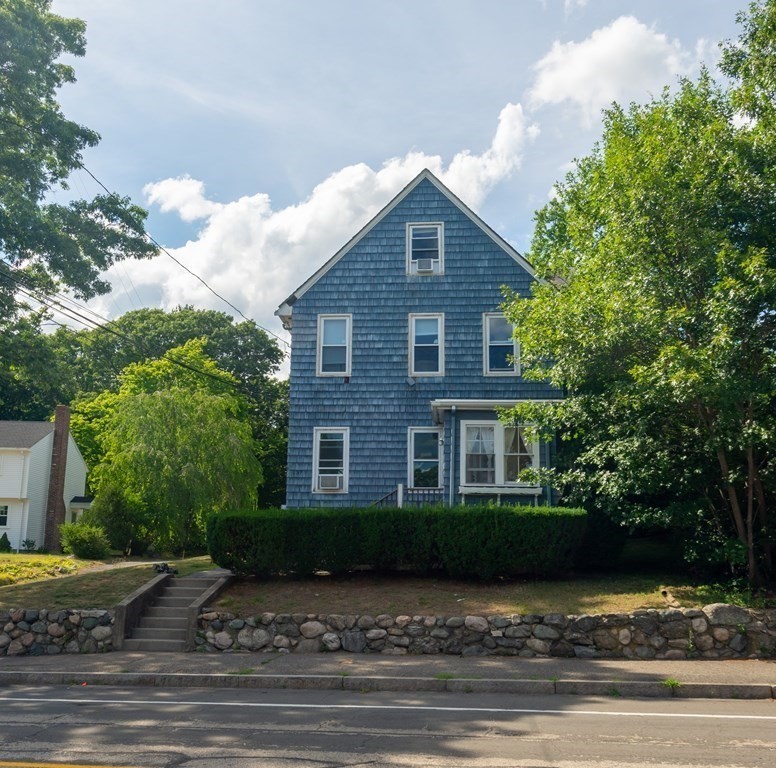 137 Central Avenue, Unit 1 Needham, MA 02494 - Photo 1 of 1 a front view of a house with a yard