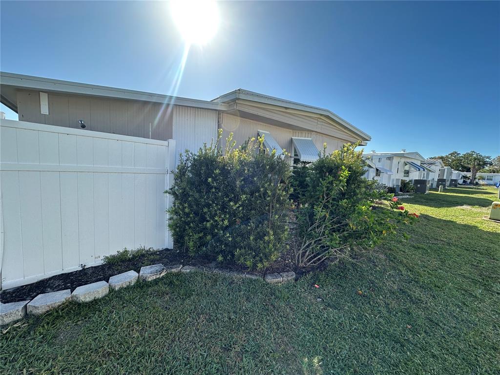 5800 Forsythia Road Venice, FL 34293 - Photo 16 of 27 a view of a house with a yard and plants