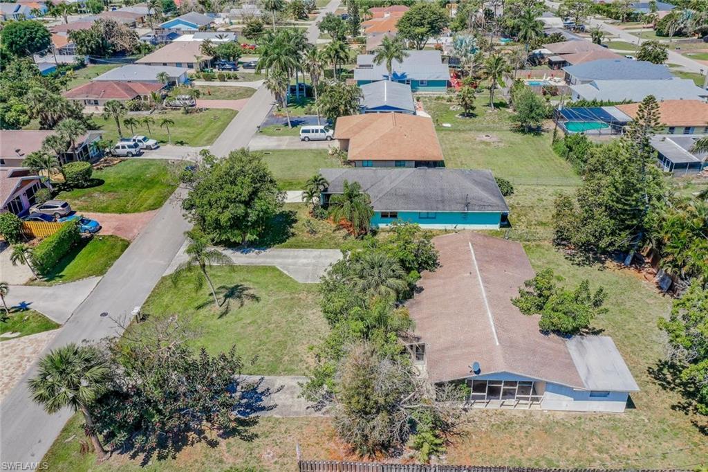 771 104th Avenue North Naples, FL 34108 - Photo 4 of 10 an aerial view of a house with a garden