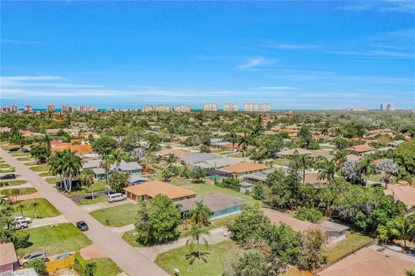 an aerial view of residential building with green space
