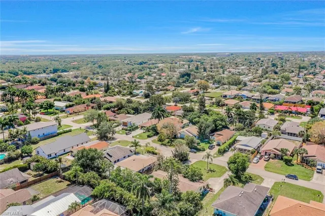 an aerial view of residential building and ocean