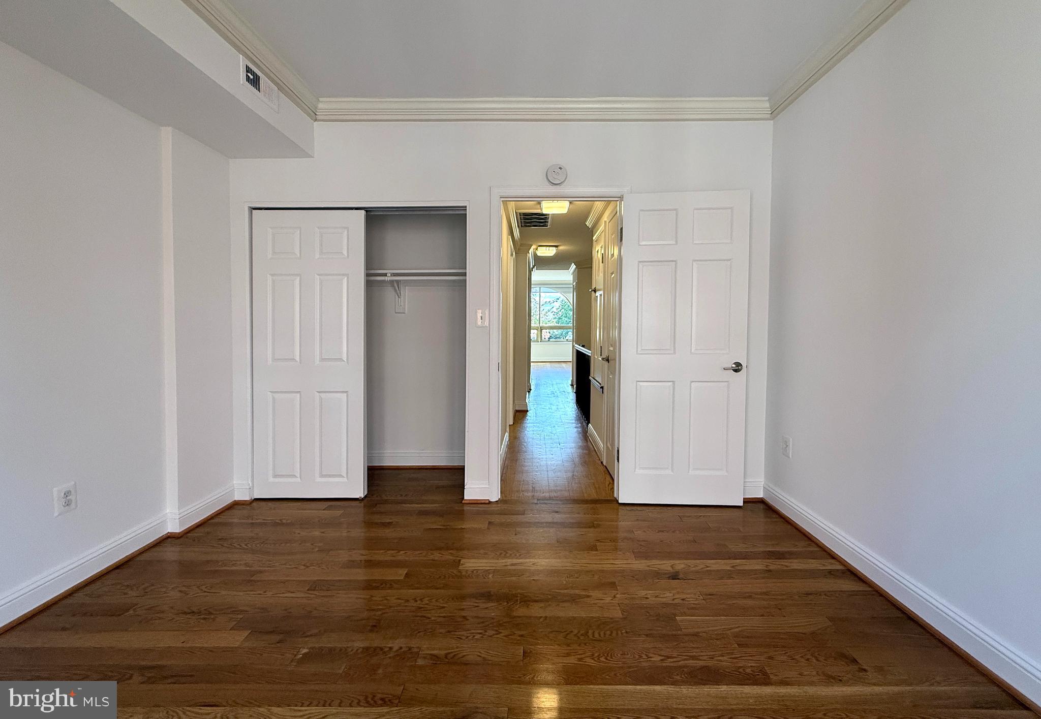 2719 M Street Northwest, Unit 2719 Washington, DC 20007 - Photo 12 of 21 a view of empty room with wooden floor and entryway
