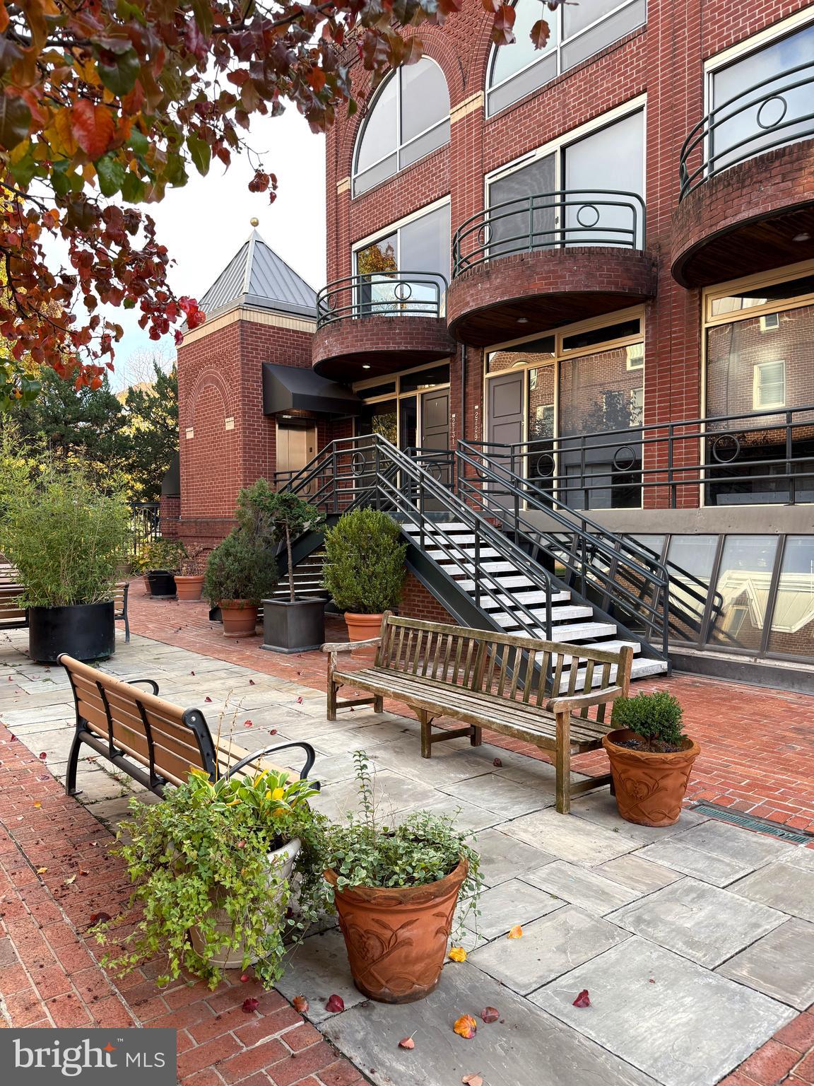 2719 M Street Northwest, Unit 2719 Washington, DC 20007 - Photo 19 of 21 a view of a chairs and table in a patio