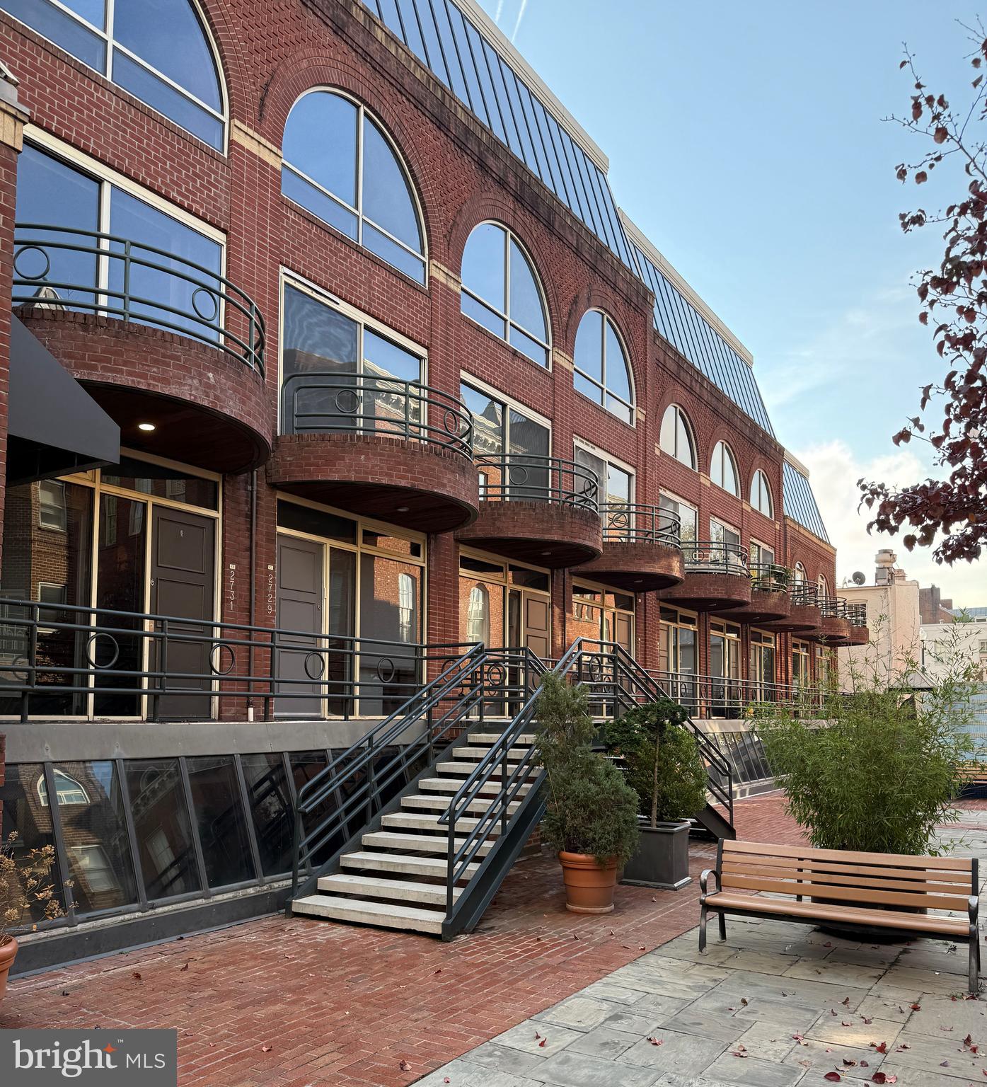 2719 M Street Northwest, Unit 2719 Washington, DC 20007 - Photo 20 of 21 a view of a building with stairs and wooden fence
