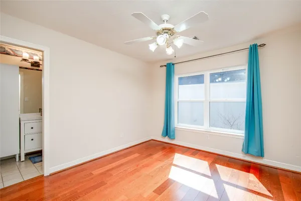 a bathroom with a shower a toilet and a shower