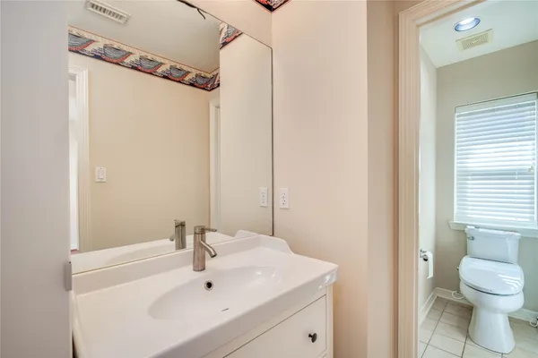 a bathroom with a sink and a large mirror