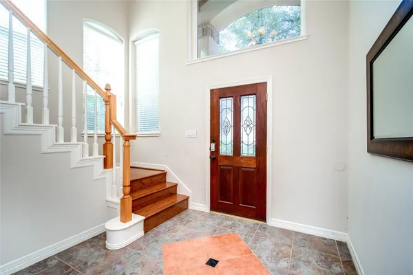 a view of a hallway with bathroom