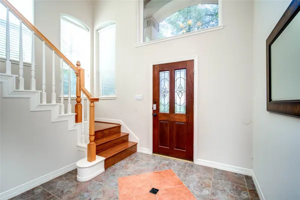 a view of a hallway with bathroom