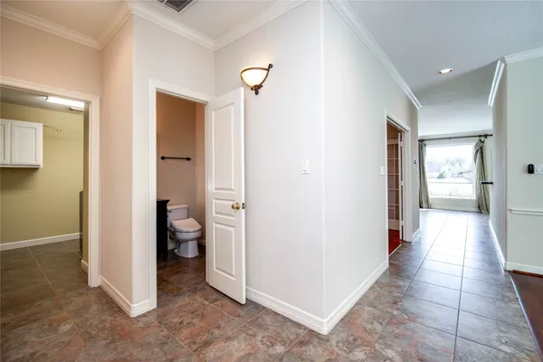 a utility room with stainless steel appliances granite countertop a sink stove and cabinets