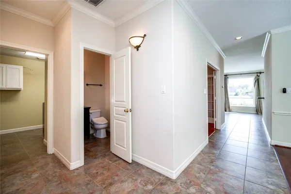 a utility room with stainless steel appliances granite countertop a sink stove and cabinets