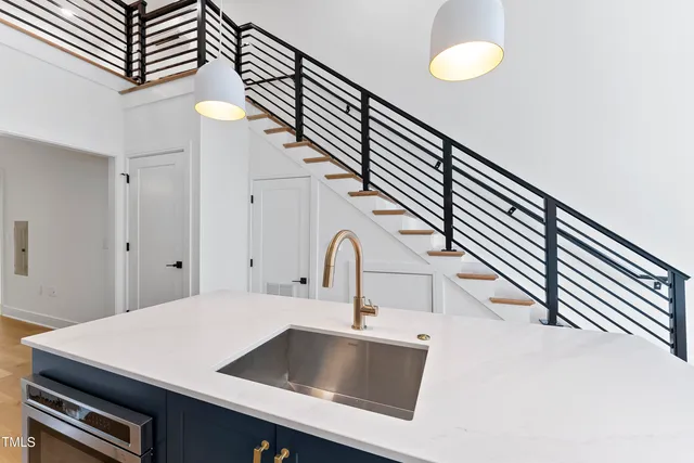 a kitchen with a sink and a stove