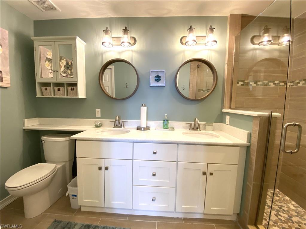 2730 Cypress Trace Circle, Unit 2820 Naples, FL 34119 - Photo 16 of 35 Master Bath