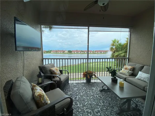 a view of backyard with swimming pool and patio