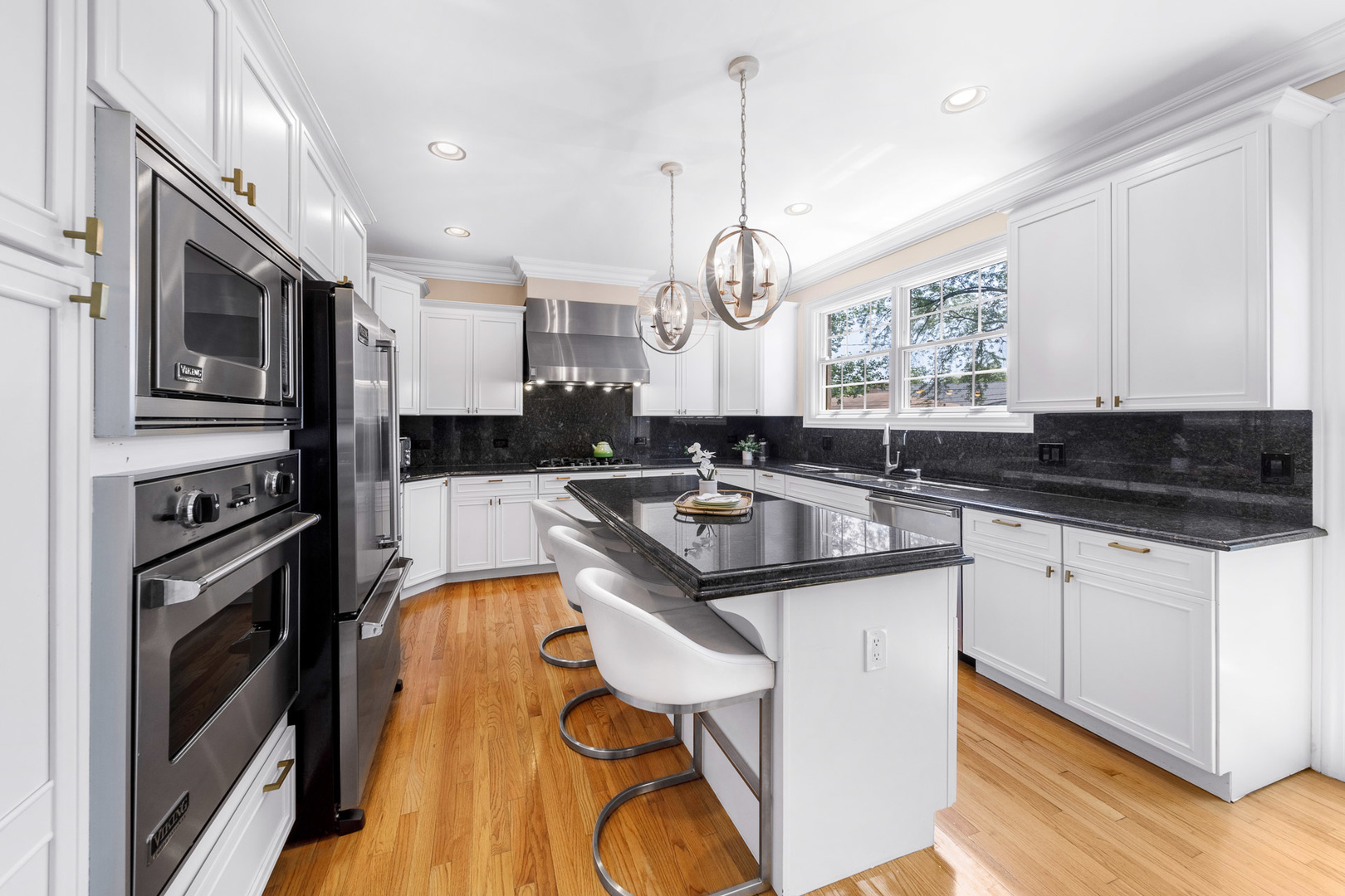 2235 Covert Road Glenview, IL 60025 - Photo 11 of 35 a kitchen with stainless steel appliances granite countertop a sink a stove and a refrigerator