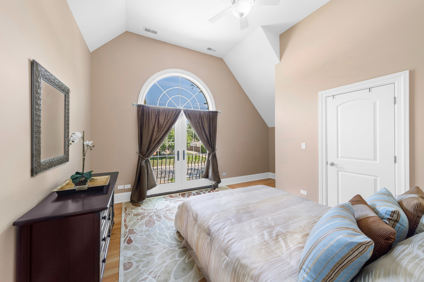 2235 Covert Road Glenview, IL 60025 - Photo 20 of 35 a bedroom with a bed a mirror on dresser and a window