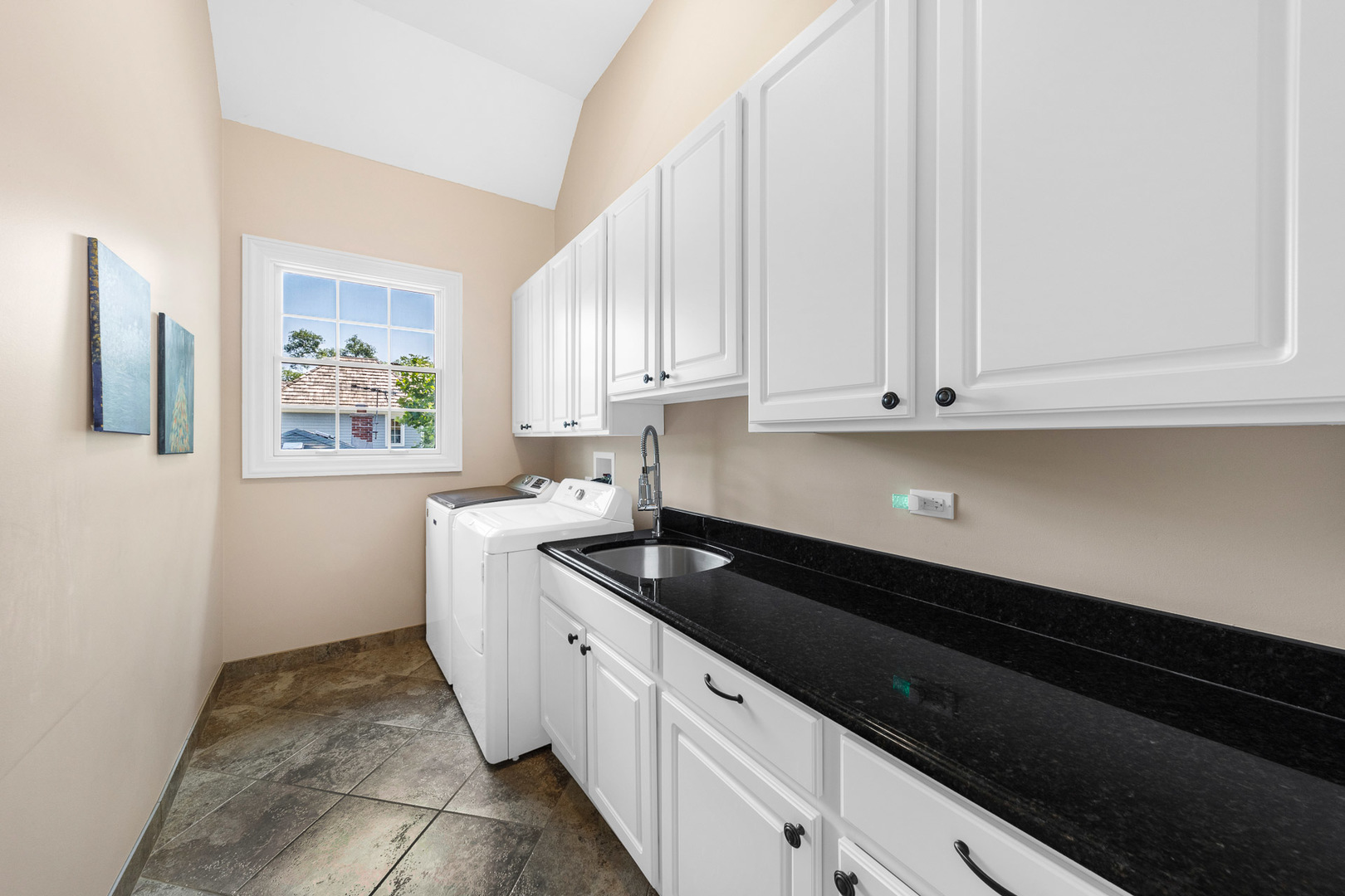 2235 Covert Road Glenview, IL 60025 - Photo 27 of 35 a kitchen with granite countertop white cabinets and black appliances