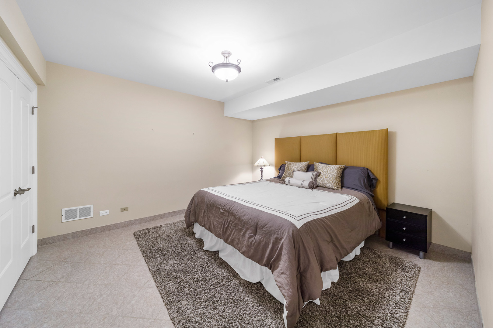 2235 Covert Road Glenview, IL 60025 - Photo 31 of 35 a bed room with a bed and a night stand