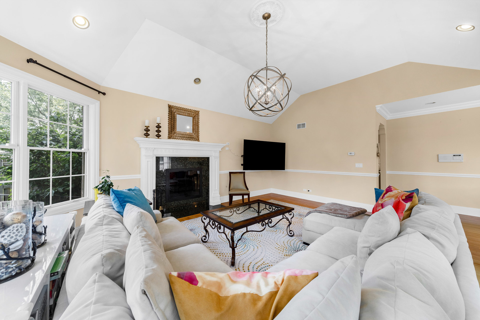 2235 Covert Road Glenview, IL 60025 - Photo 5 of 35 a living room with furniture a fireplace and a flat screen tv