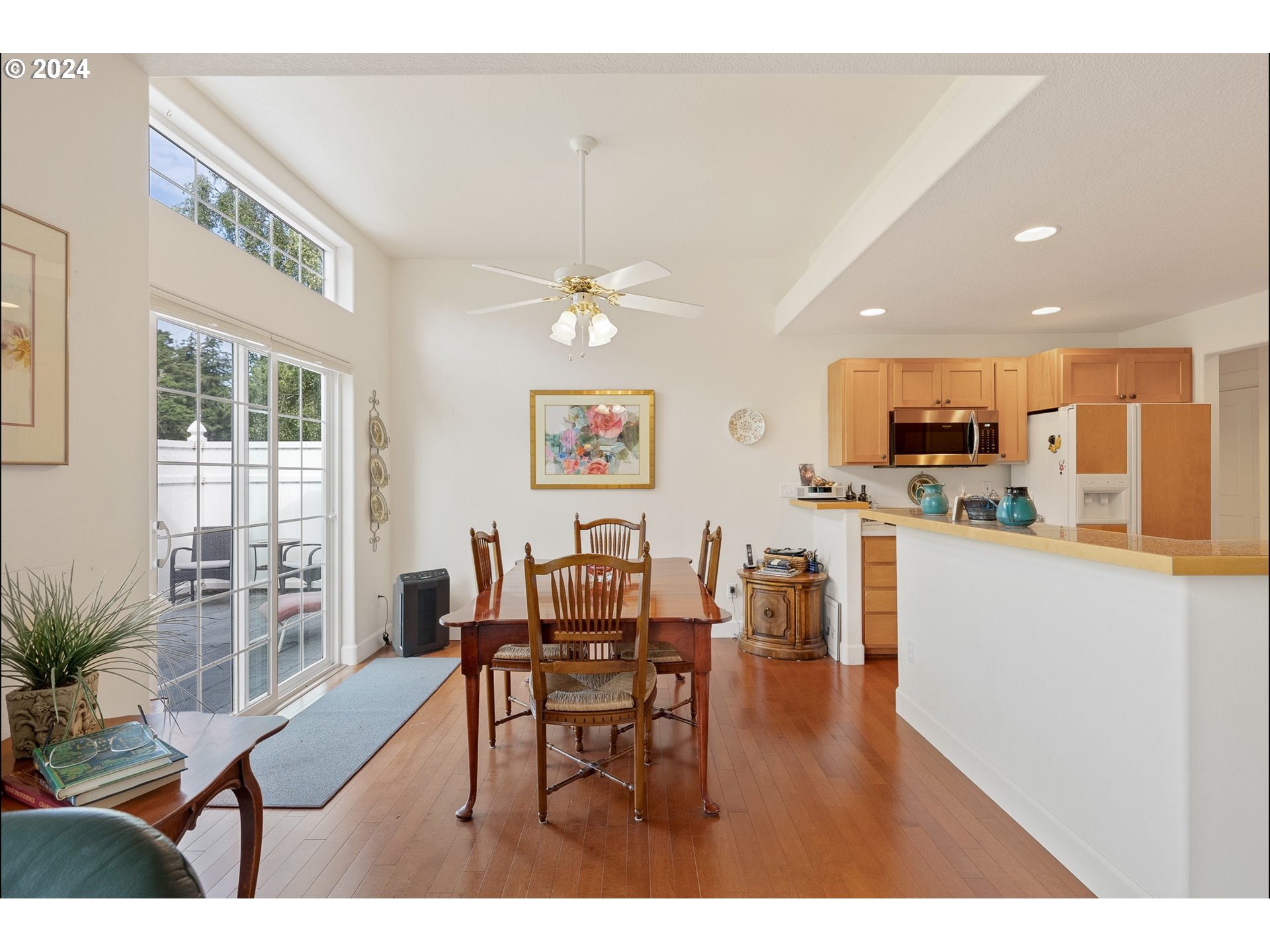 3 Waterford Downs Florence, OR 97439 - Photo 16 of 46 a open kitchen with stainless steel appliances granite countertop a refrigerator dining table and chairs