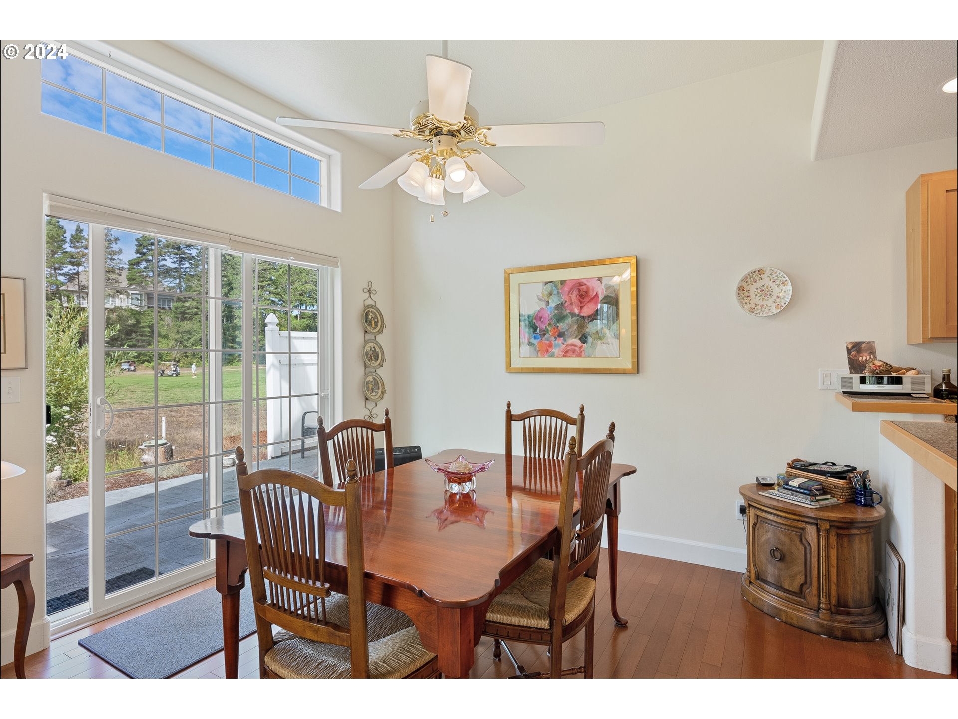 3 Waterford Downs Florence, OR 97439 - Photo 17 of 46 a dining room with furniture a chandelier and wooden floor