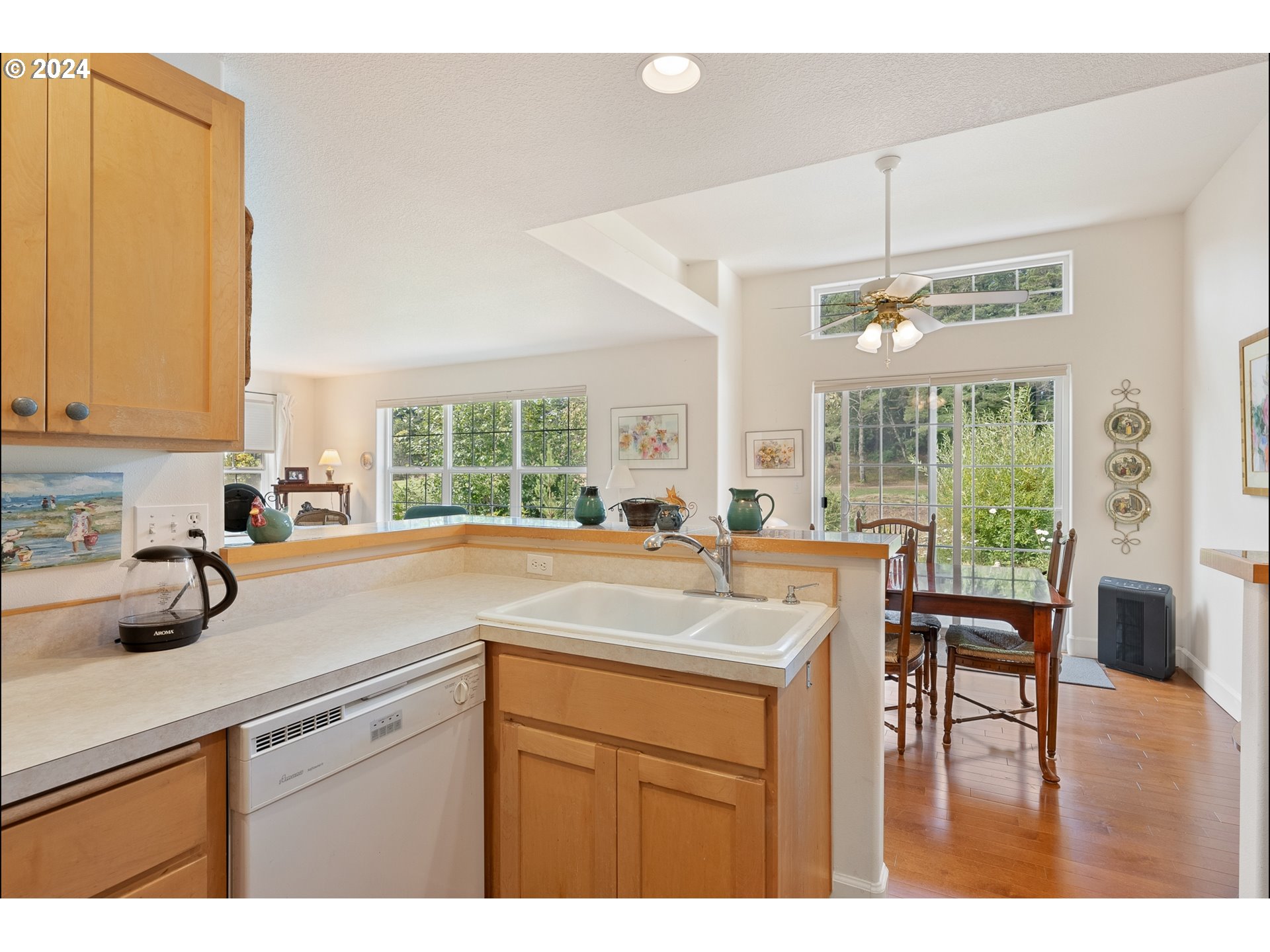 3 Waterford Downs Florence, OR 97439 - Photo 20 of 46 a kitchen with a sink a counter top space and living room view