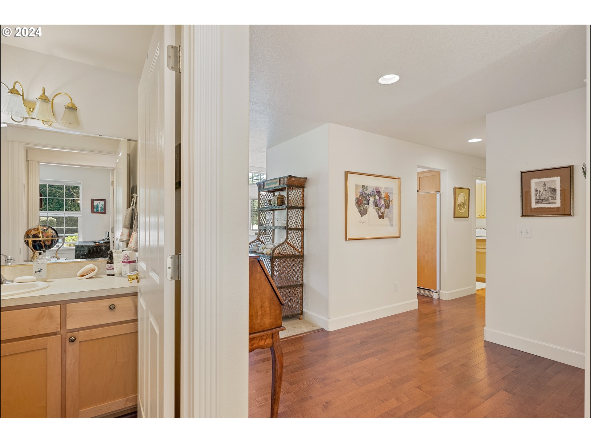 3 Waterford Downs Florence, OR 97439 - Photo 25 of 46 a view of a hallway with bathroom and wooden floor