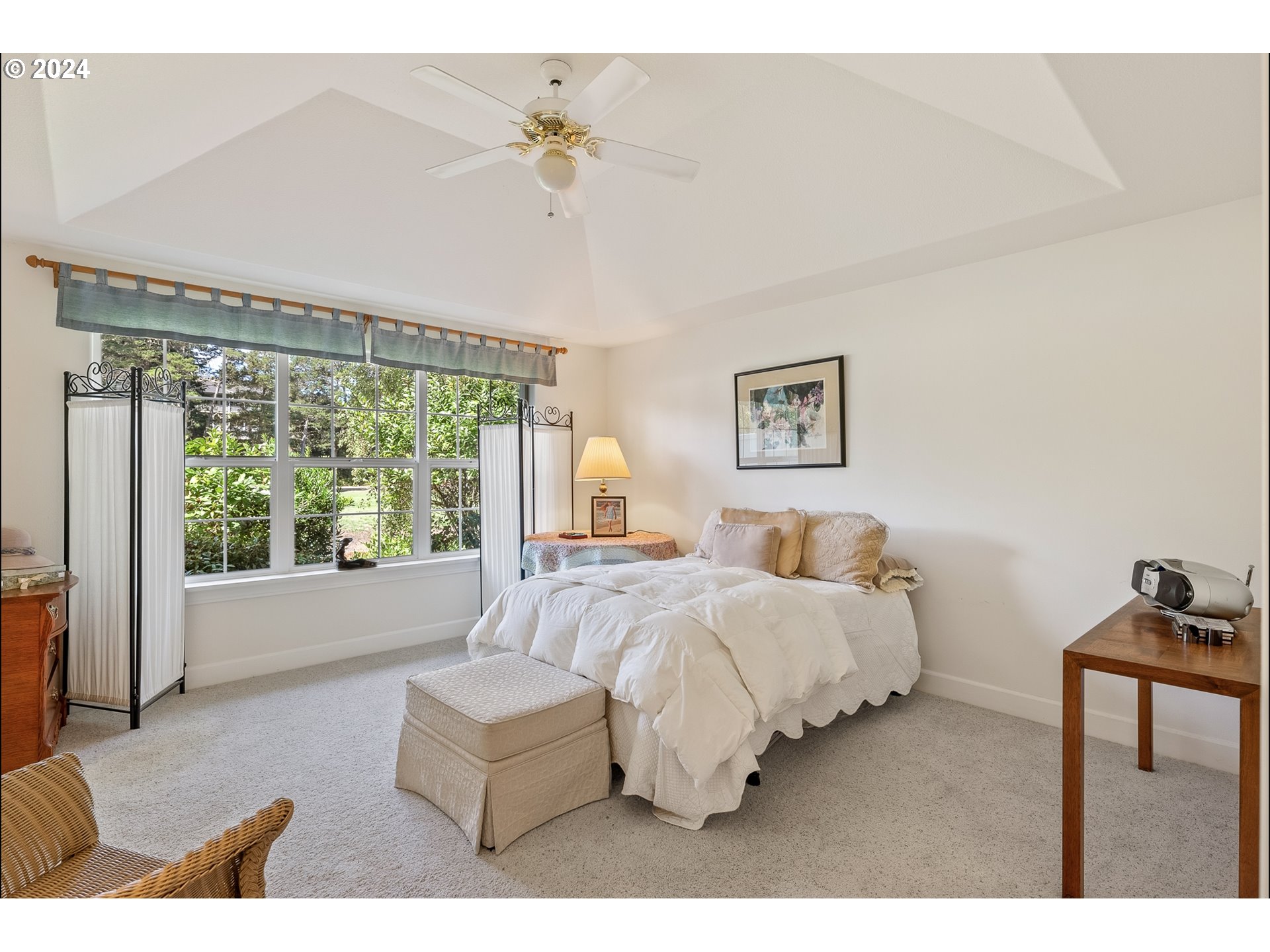3 Waterford Downs Florence, OR 97439 - Photo 37 of 46 a bedroom with furniture and a large window