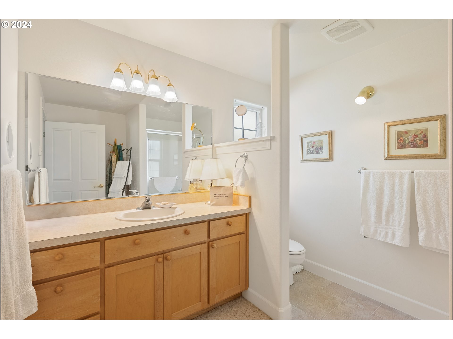 3 Waterford Downs Florence, OR 97439 - Photo 41 of 46 a bathroom with a sink a toilet and a mirror