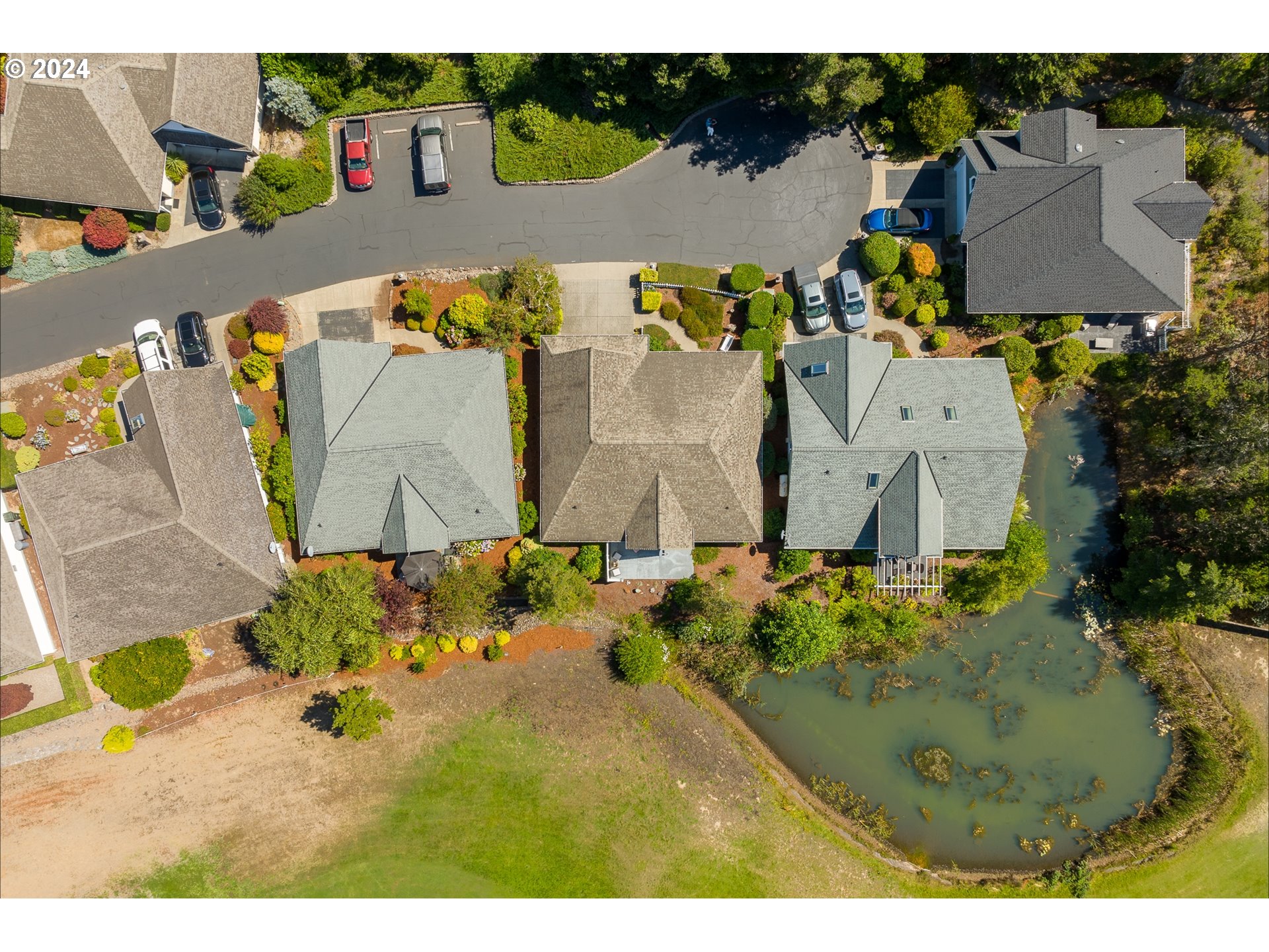 3 Waterford Downs Florence, OR 97439 - Photo 8 of 46 an aerial view of a house with a swimming pool